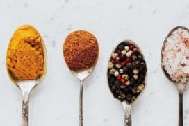 composition of spoonfuls with various spices for healthy food preparing